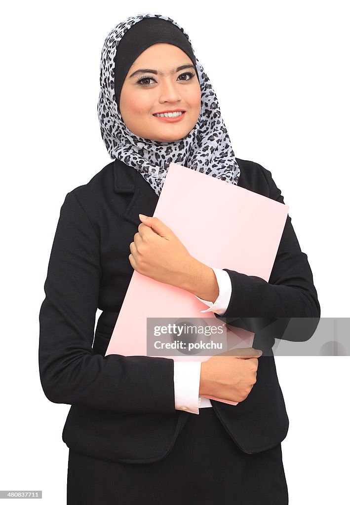 Portrait of young and successful businesswoman holding file folder