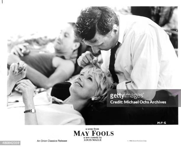 Actor Bruno Carette and actress Miou-Miou in a scene from the movie " May Fools ", circa 1990.