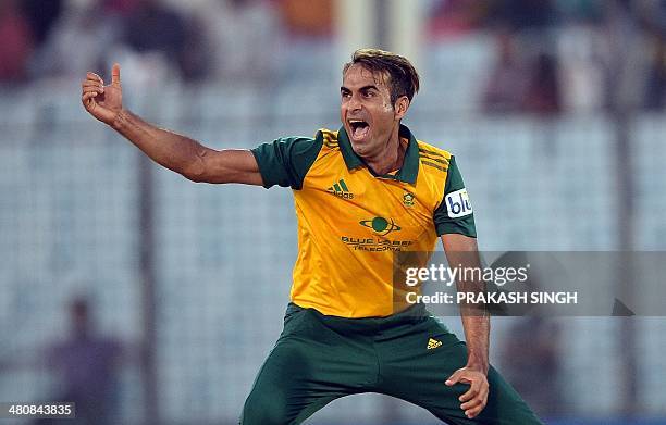 South Africa bowler Imran Tahir celebrates the wicket of Netherlands batsman Wesley Barresi during the ICC World Twenty20 tournament cricket match...