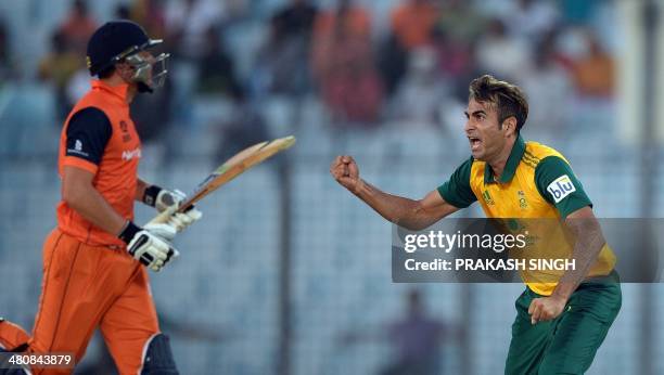 South Africa bowler Imran Tahir celebrates the wicket of Netherlands batsman Wesley Barresi during the ICC World Twenty20 tournament cricket match...