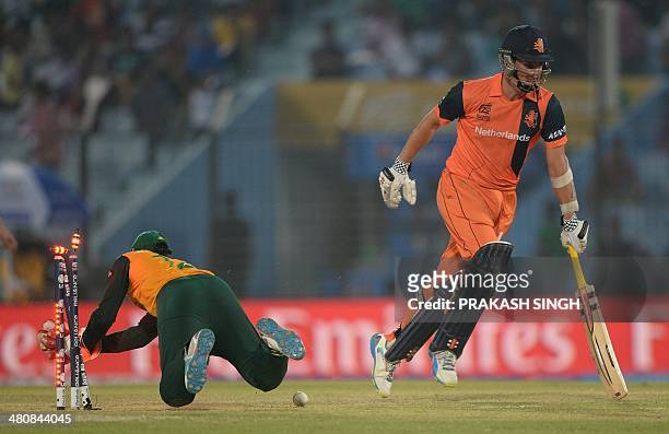 Netherlands batsman Tom Cooper successfully completes a run during the ICC World Twenty20 tournament cricket match between South Africa and...