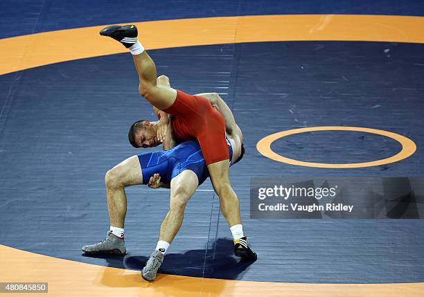Andrew Bisek of the USA and Alvis Almendra of Panama compete for the Men's 75kg Greco-Roman Gold Medal during the Toronto 2015 Pan Am Games at the...
