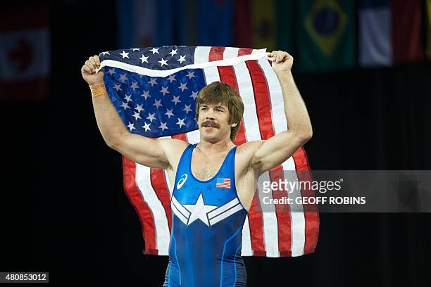 Gold medalist Andrew Bisek of the United States celebrates his win over Alvis Almendra of Panama in the 75kg class of the men's greco-roman wrestling...