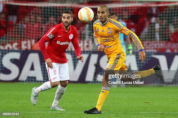 Lisandro Lopez of Internacional battles for the ball against Guido Pizarro of Tigres during the match between Internacional v Tigres as part of Copa...