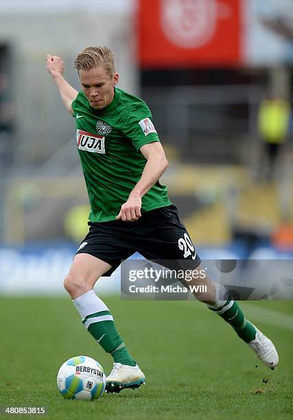 Dennis Grote of Muenster kicks the ball during the Third League match between Jahn Regensburg and Preussen Muenster at Jahnstadion on March 22, 2014...