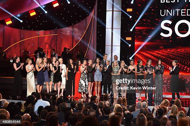 The U.S. Women's National Soccer team accepts the award for Best Team from actor Vince Vaughn and NFL player Brett Favre during The 2015 ESPYS at...