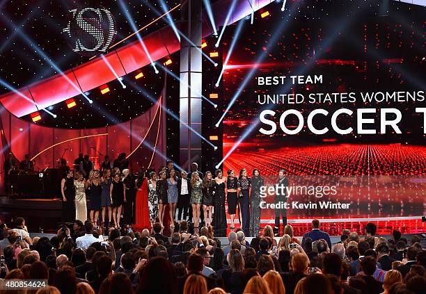 The U.S. Women's National Soccer team accepts the award for Best Team from actor Vince Vaughn and NFL player Brett Favre during The 2015 ESPYS at...