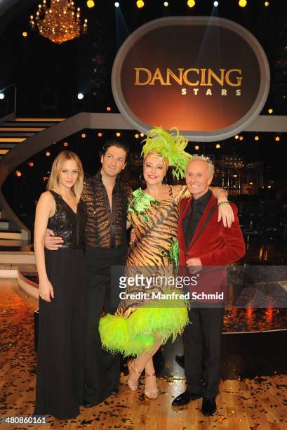 Miriam Weichselbraun, Thomas Kraml, Andrea Buday and Klaus Eberhartinger pose for a photograph during the 'Dancing Stars' TV Show after party at ORF...