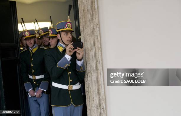 Members of an Italian honor guard watch as US President Barack Obama arrives for meetings with Italian President Giorgio Napolitano at Quirinal...