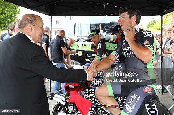 French Minister of Defence Jean-Yves Le Drian greets Pierrick Fedrigo of France and Bretagne Seche Environnement during stage nine of the 2015 Tour...