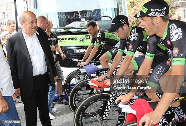French Minister of Defence Jean-Yves Le Drian greets the riders of Team Bretagne Seche Environnement during stage nine of the 2015 Tour de France, a...