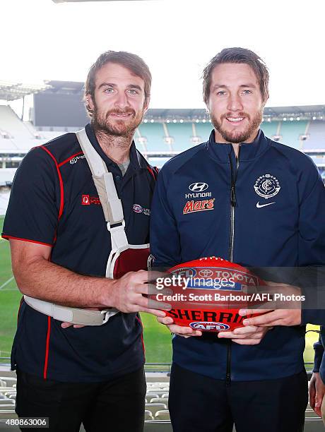 Jobe Watson of the Bombers and Dale Thomas of the Blues pose during the AFL Multicultural Round launch at the Melbourne Cricket Ground on July 16,...