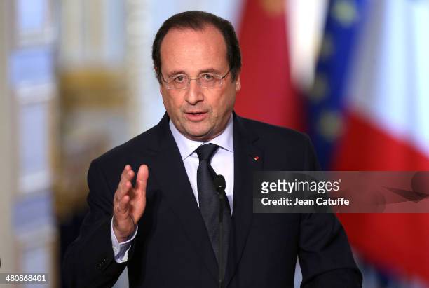 French President Francois Hollande and President of China Xi Jinping address the press after their meeting at Elysee Palace on March 26, 2014 in...