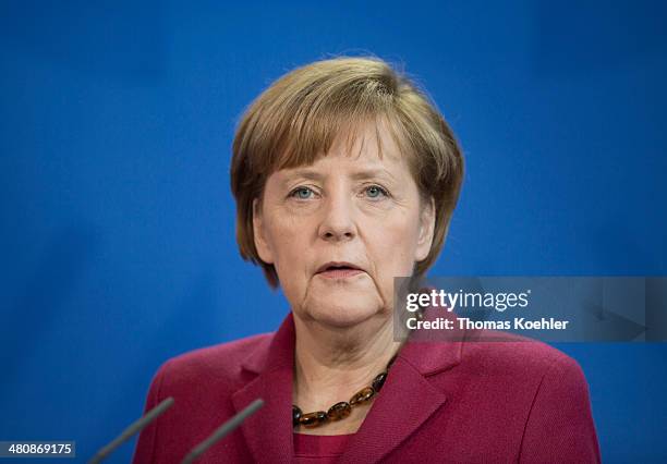 German Chancellor Angela Merkel speak to members of the media during a press conference in the Federal Chancellery on March 27, 2014 in Berlin,...