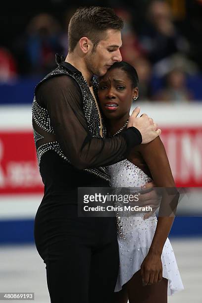 Vanessa James is comforted by partner Morgan Cipres of France after she was dropped on the ice in the Pairs Free Program during ISU World Figure...