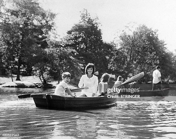 Far away from the US electoral campaign, Jacqueline Kennedy and her children John-john and Caroline go boating in Central Park, New York, on...