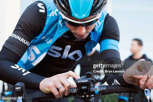 Peter Kennaugh of Team SKY adjusts his garmin ahead of a training ride on February 3, 2014 in Palma de Mallorca, Spain.