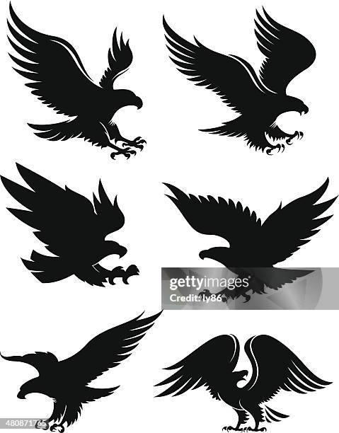 eagle silhouettes - eagle flying stock illustrations