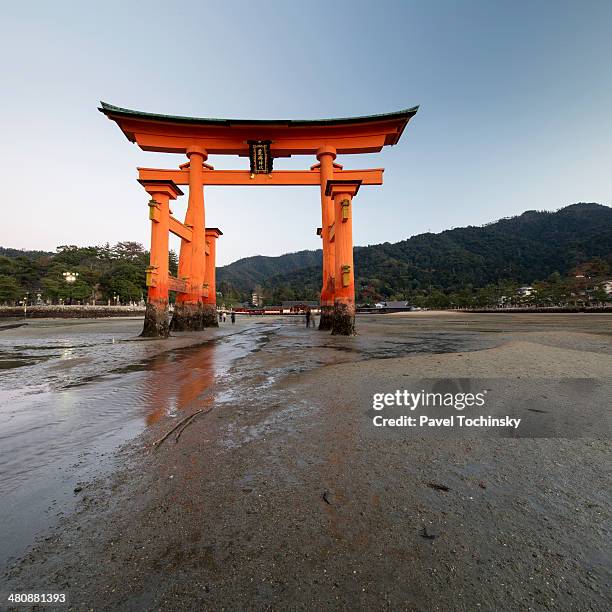 miyajima torri gate at sunset, itsukushima shrine - torii gate stock pictures, royalty-free photos & images