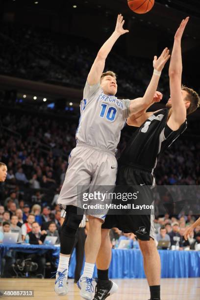 Grant Gibbs of the Creighton Bluejays drives to the basket during the Big East Men's Basketball Tournament Final game against the Providence Friars...