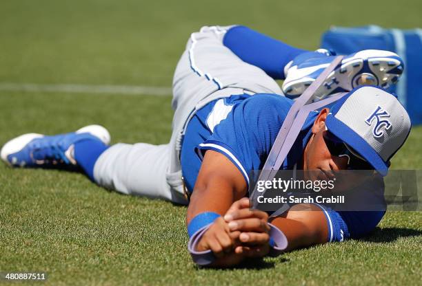 Angel Franco of the Kansas City Royals stretches before a game against the Cincinnati Reds at Goodyear Ballpark on March 21, 2014 in Goodyear,...