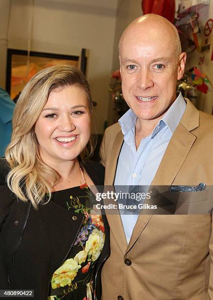 Kelly Clarkson and Anthony Warlow pose backstage at the hit musical "Finding Neverland" on Broadway at The Lunt Fontanne Theater on July 15, 2015 in...