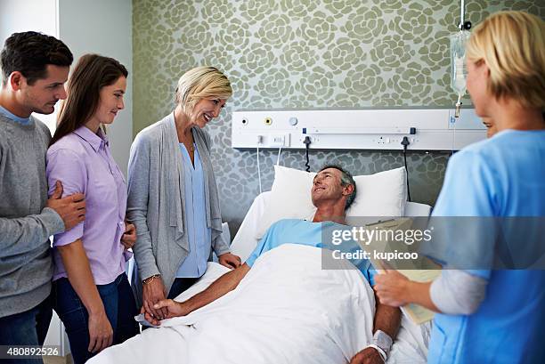 surrounded by loved ones - patient surrounded by family stock pictures, royalty-free photos & images
