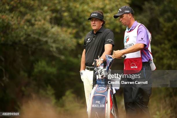 Phil Phil Mickelson and his caddy Jim Mackay wait to tee off on the 14th during Round One of the Valero Texas Open at the AT&T Oaks Course on March...