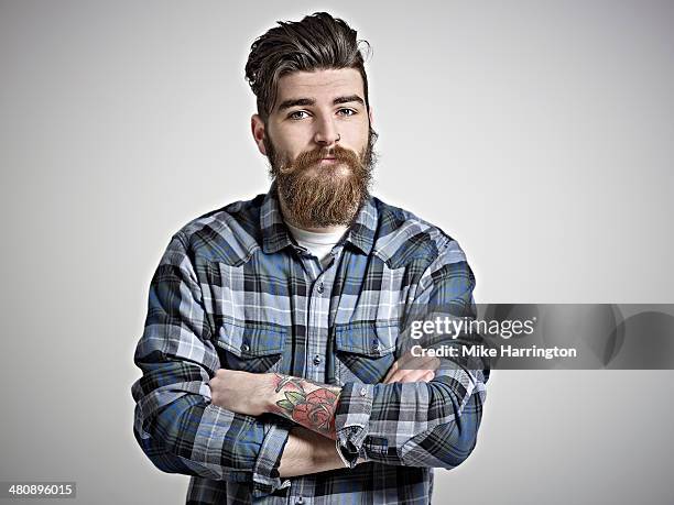 portrait of man with beard, tattoos & check shirt. - tattoo closeup stock pictures, royalty-free photos & images