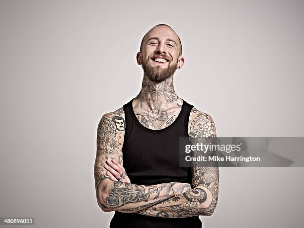 portrait of bearded man with tattoos laughing. - eccentric ストックフォトと画像