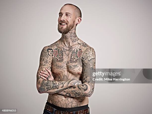 A young man with a heavily tattooed body, signifying his affiliation with the Aryan Brotherhood