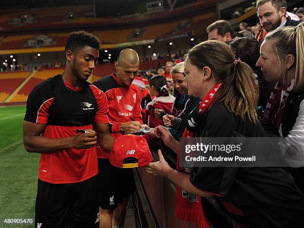Joe Gomez and Martin Skrtel of Liverpool signing fans shirts at the end of a training session at Suncorp Stadium on July 16, 2015 in Brisbane,...