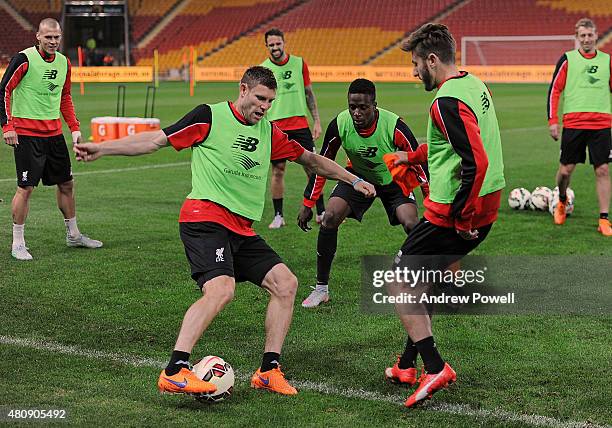 James Milner and Divock Origi of Liverpool in action during a training session at Suncorp Stadium on July 16, 2015 in Brisbane, Australia.