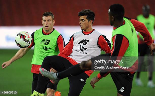 James Milner and Joao Teixeira of Liverpool in action during a training session at Suncorp Stadium on July 16, 2015 in Brisbane, Australia.