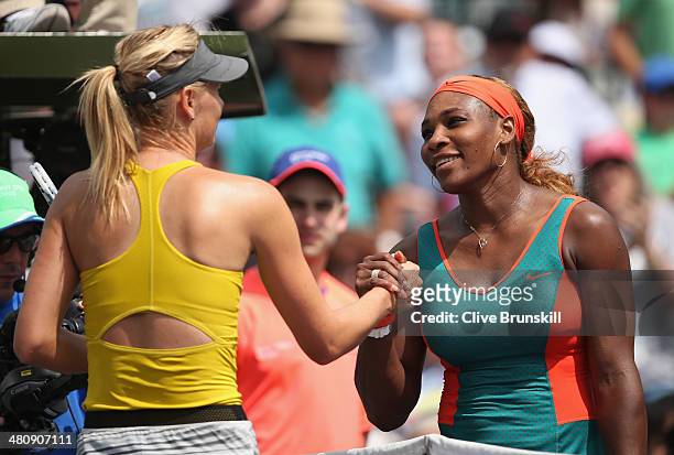 Serena Williams of the United States shakes hands at the net after her straight sets victory against Maria Sharapova of Russia during their semi...