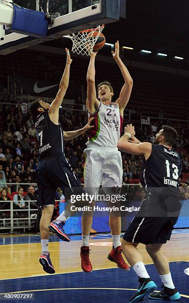 Tibor Pleiss, #21 of Laboral Kutxa Vitoria competes with Kostas Vasileiadis, #7 of Anadolu Efes Istanbul and Deniz Kilicli, #13 of Anadolu Efes...