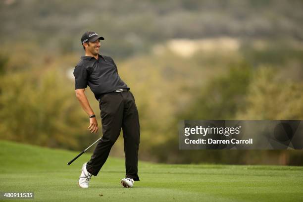 Alex Aragon plays his second shot on the 13th during Round One of the Valero Texas Open at the AT&T Oaks Course on March 27, 2014 in San Antonio,...
