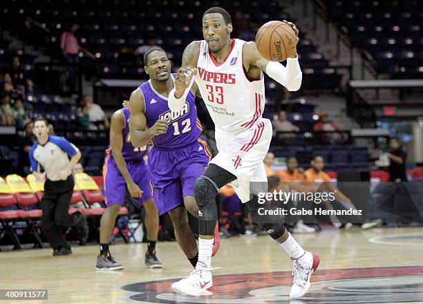 Robert Covington of the Rio Grande Valley Vipers dribbles the ball down court past Othyus Jeffers of the Iowa Energy on March 26, 2014 at the State...