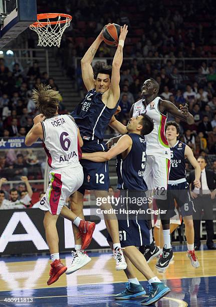 Kerem Gonlum, #12 of Anadolu Efes Istanbul competes with Giuseppe Poeta, #6 of Laboral Kutxa Vitoria in action during the 2013-2014 Turkish Airlines...
