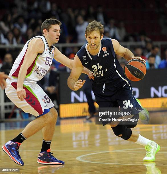 Zoran Planinic, #34 of Anadolu Efes Istanbul competes with Fabien Causeur, #55 of Laboral Kutxa Vitoria in action during the 2013-2014 Turkish...