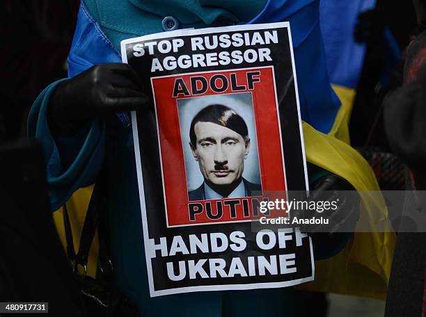 Ukrainians living in United States protest outside the United Nations Headquarters as the U.N. General Assembly votes a draft resolution on the...