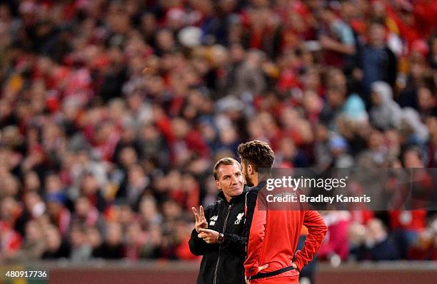 Manager Brendan Rodgers talks tactics with Adam Lallana during a Liverpool FC training session at Suncorp Stadium on July 16, 2015 in Brisbane,...