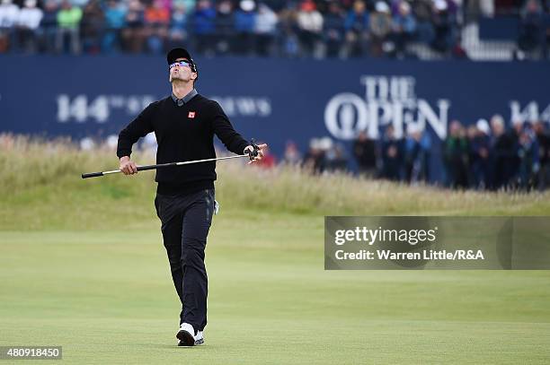 Adam Scott of Australia reacts to his putt on the first green during the first round of the 144th Open Championship at The Old Course on July 16,...