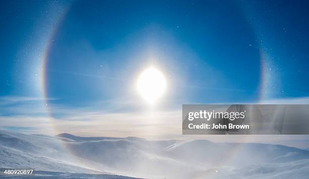 'snow dog' surrounding the sun, eagle summit, ak - sundog stock pictures, royalty-free photos & images