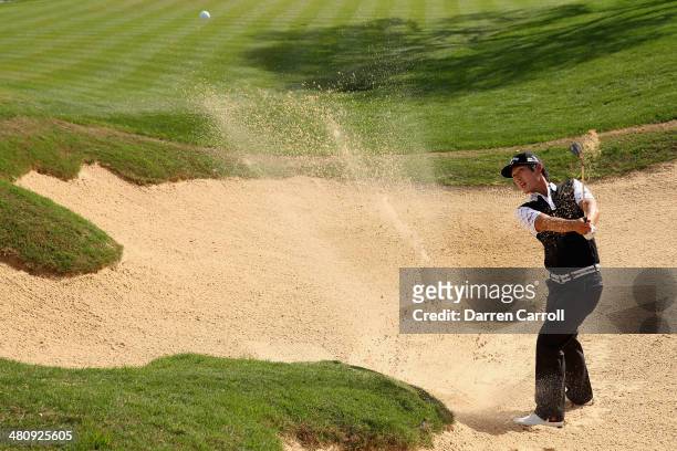 Danny Lee takes his third shot form the bunker on the 18th during Round One of the Valero Texas Open at the AT&T Oaks Course on March 27, 2014 in San...