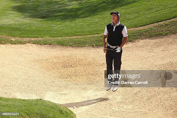 Danny Lee reacts after taking his third shot form the bunker on the 18th during Round One of the Valero Texas Open at the AT&T Oaks Course on March...