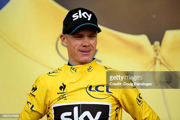 Chris Froome of Great Britain and Team Sky celebrates in the overall race leader's yellow jersey after stage twelve of the 2015 Tour de France, a 195...