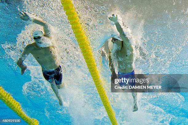 This picture taken with an underwater camera shows Max Williamson of the US and his compatriot Michael Weiss competing in the Men's 400m individual...