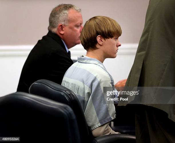 Dylan Roof , the suspect in the mass shooting that left nine dead in a Charleston church last month, appears in court accompanied by assistant...