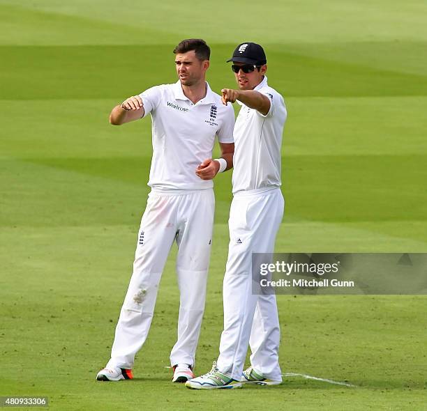 James Anderson and Alastair Cook of England arrange the fielders during day one of the 2nd Investec Ashes Test match between England and Australia at...